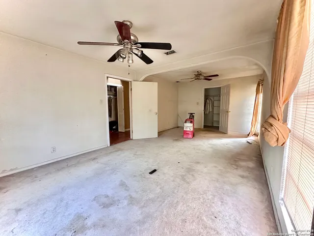 a kitchen with stainless steel appliances granite countertop a stove a sink dishwasher and a refrigerator
