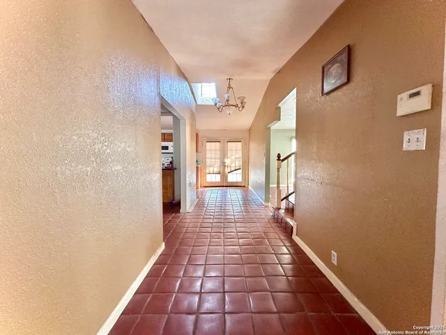 wooden floor in a hall with a window