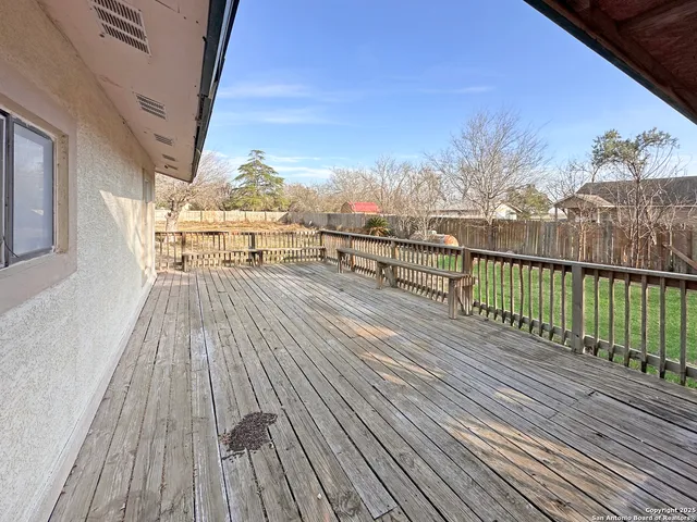 a view of a house with backyard porch and sitting area