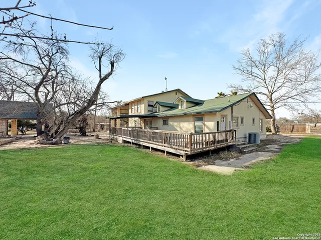 a view of a backyard with a sitting area