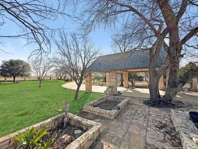 a view of a park with large trees