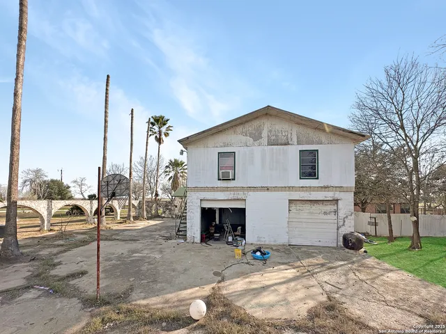 a bathroom with a bathtub shower sink vanity and toilet