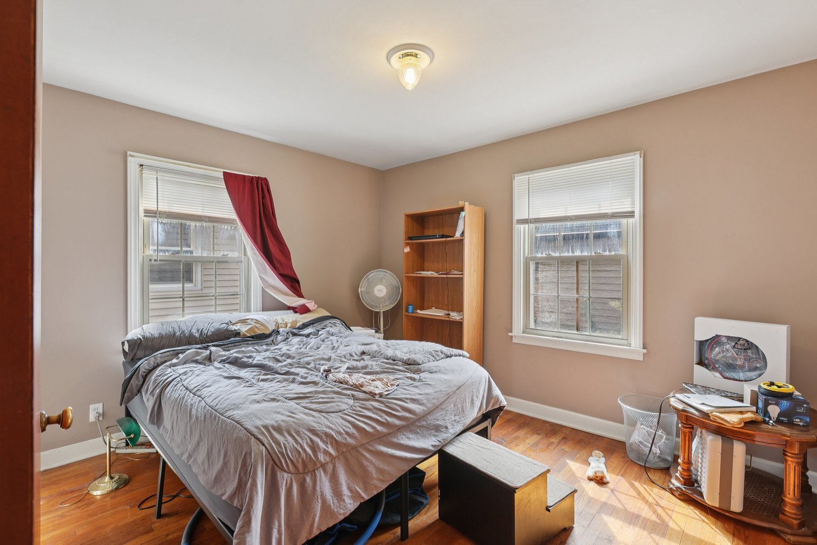 136 Hubbard Court Wauconda, IL 60084 - Photo 19 of 35 a bedroom with a bed and wooden floor