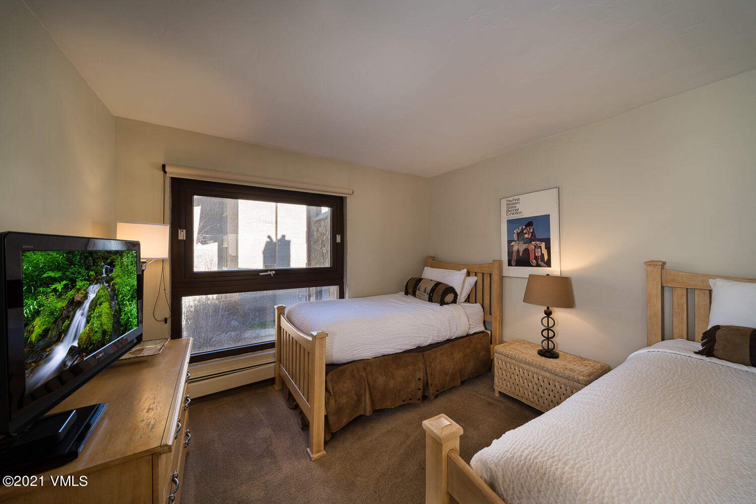 993 Lions Ridge Loop, Unit 331 Vail, CO 81657 - Photo 15 of 20 a bedroom with two beds and a flat screen tv