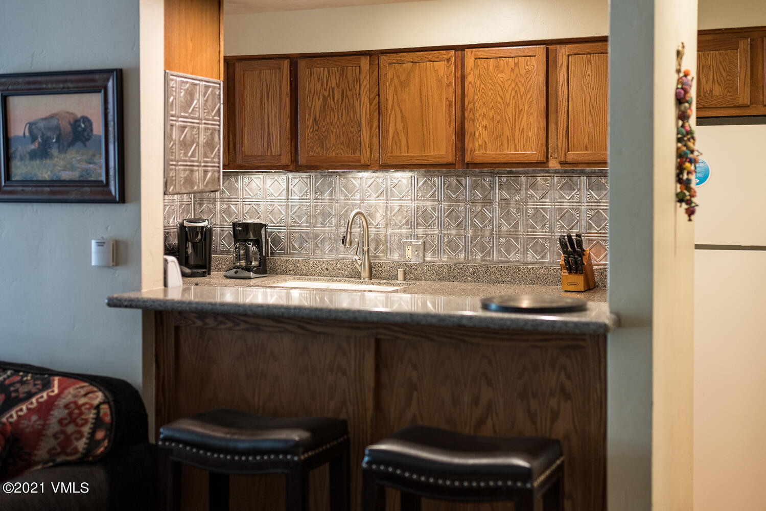 993 Lions Ridge Loop, Unit 331 Vail, CO 81657 - Photo 5 of 20 a kitchen with a sink and cabinets
