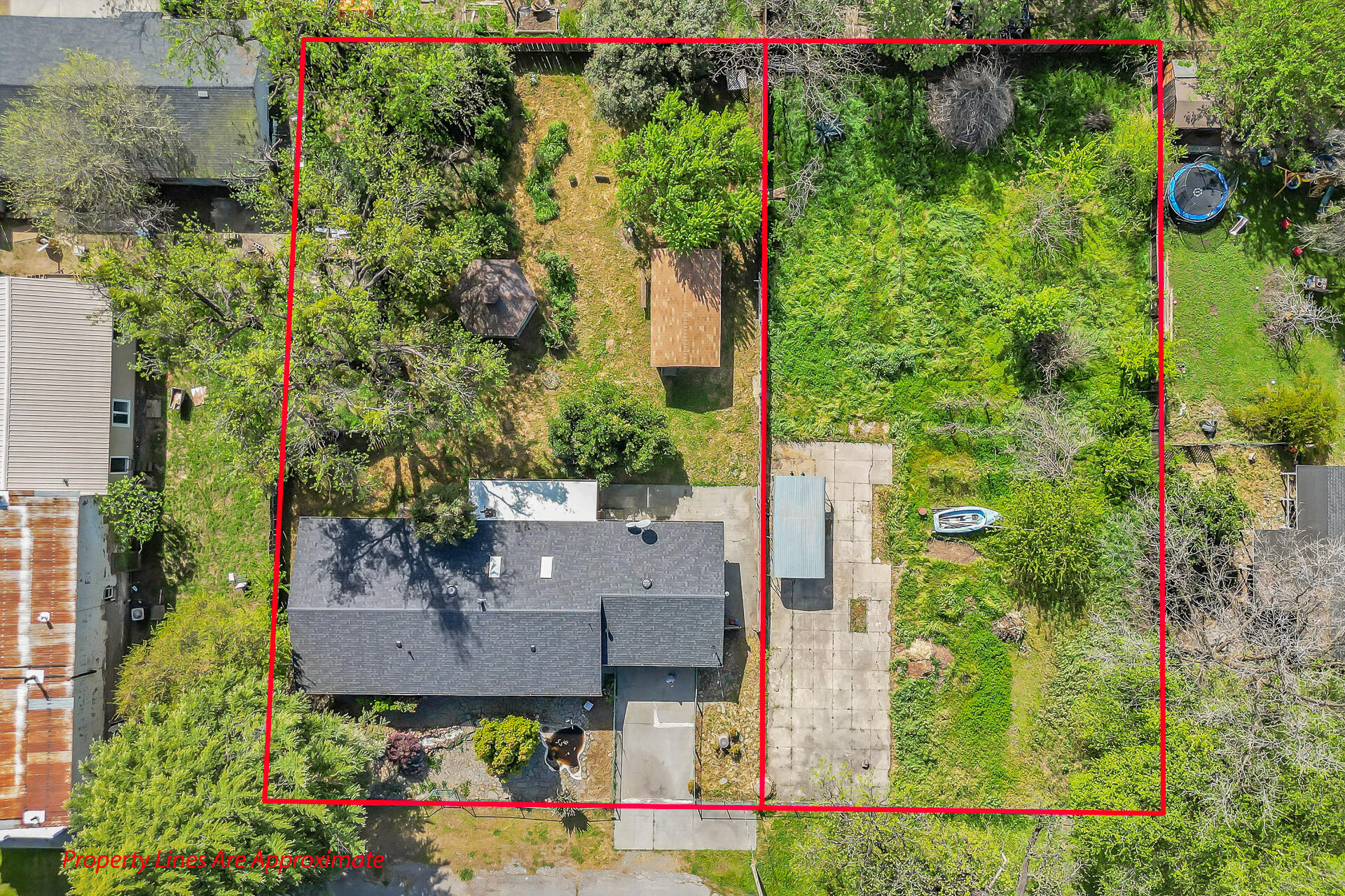 an aerial view of a house with a yard and garden