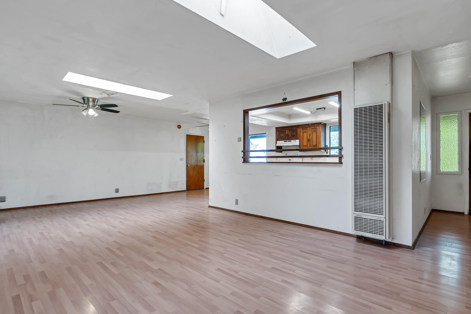 240 D Street Tehama, CA 96090 - Photo 11 of 41 an empty room with wooden floor cabinet and windows