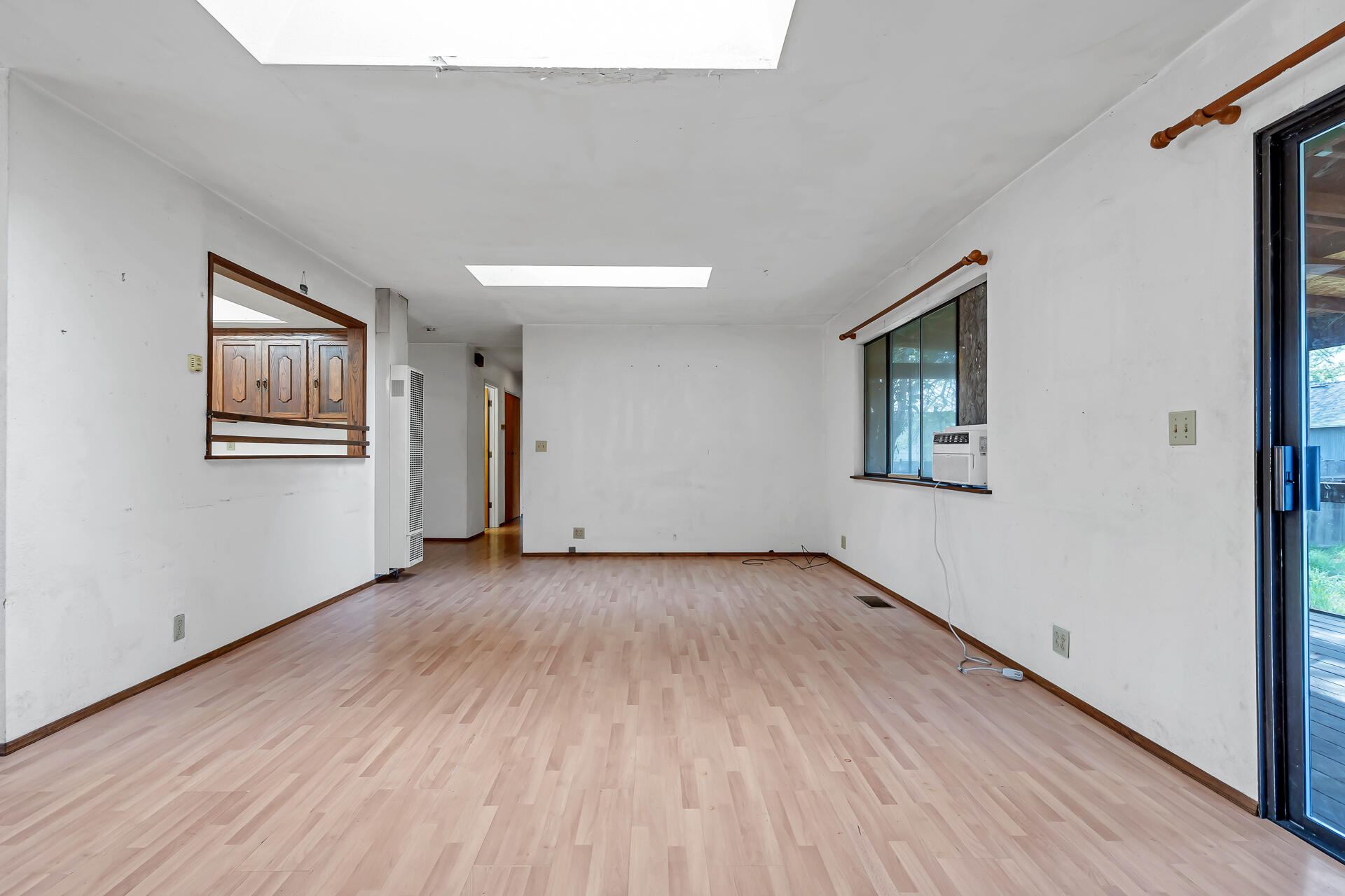 240 D Street Tehama, CA 96090 - Photo 13 of 41 a view of an empty room with wooden floor and a window
