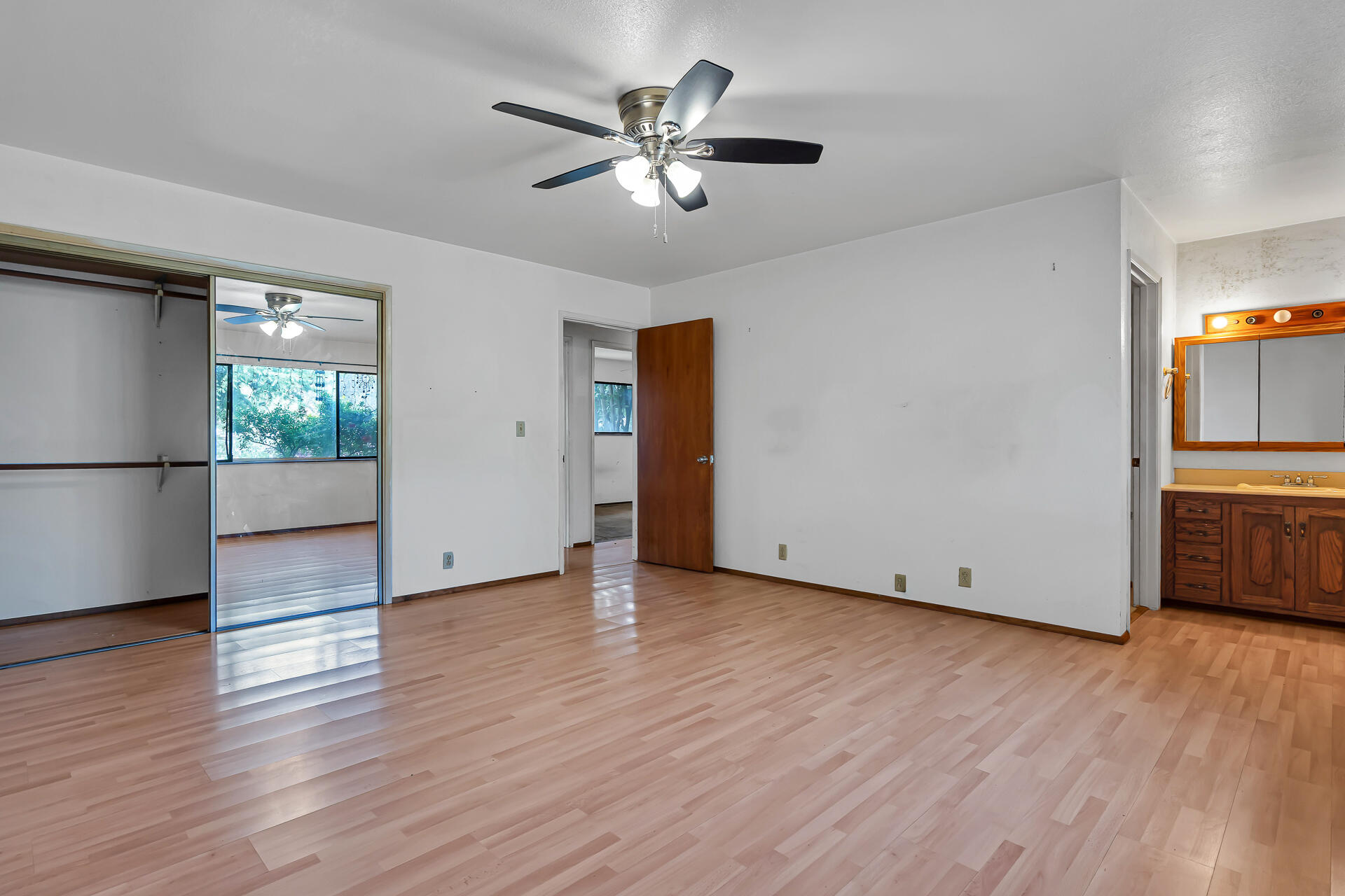 240 D Street Tehama, CA 96090 - Photo 16 of 41 a view of a livingroom with wooden floor and a ceiling fan