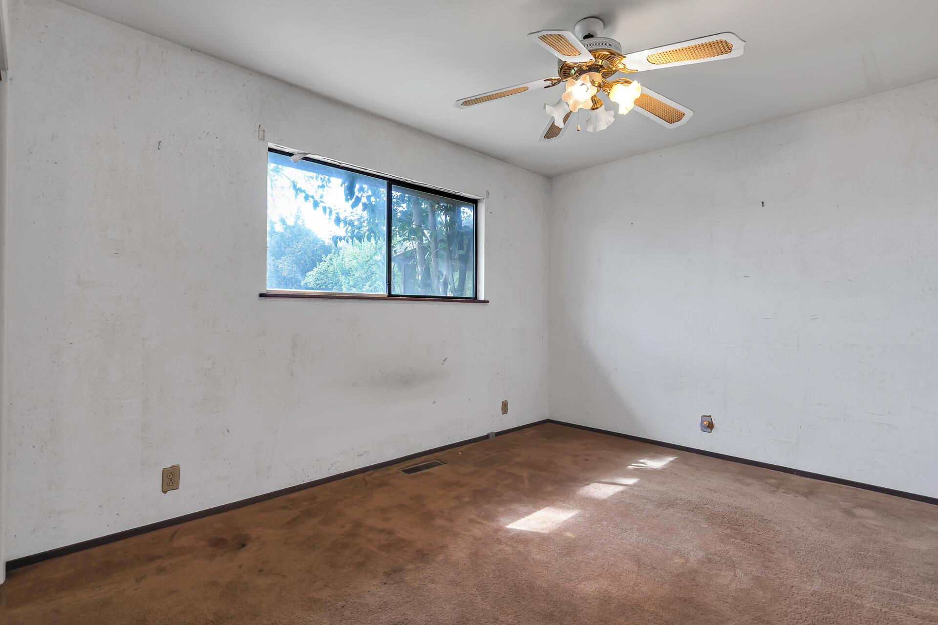240 D Street Tehama, CA 96090 - Photo 20 of 41 an empty room with a window and a fan