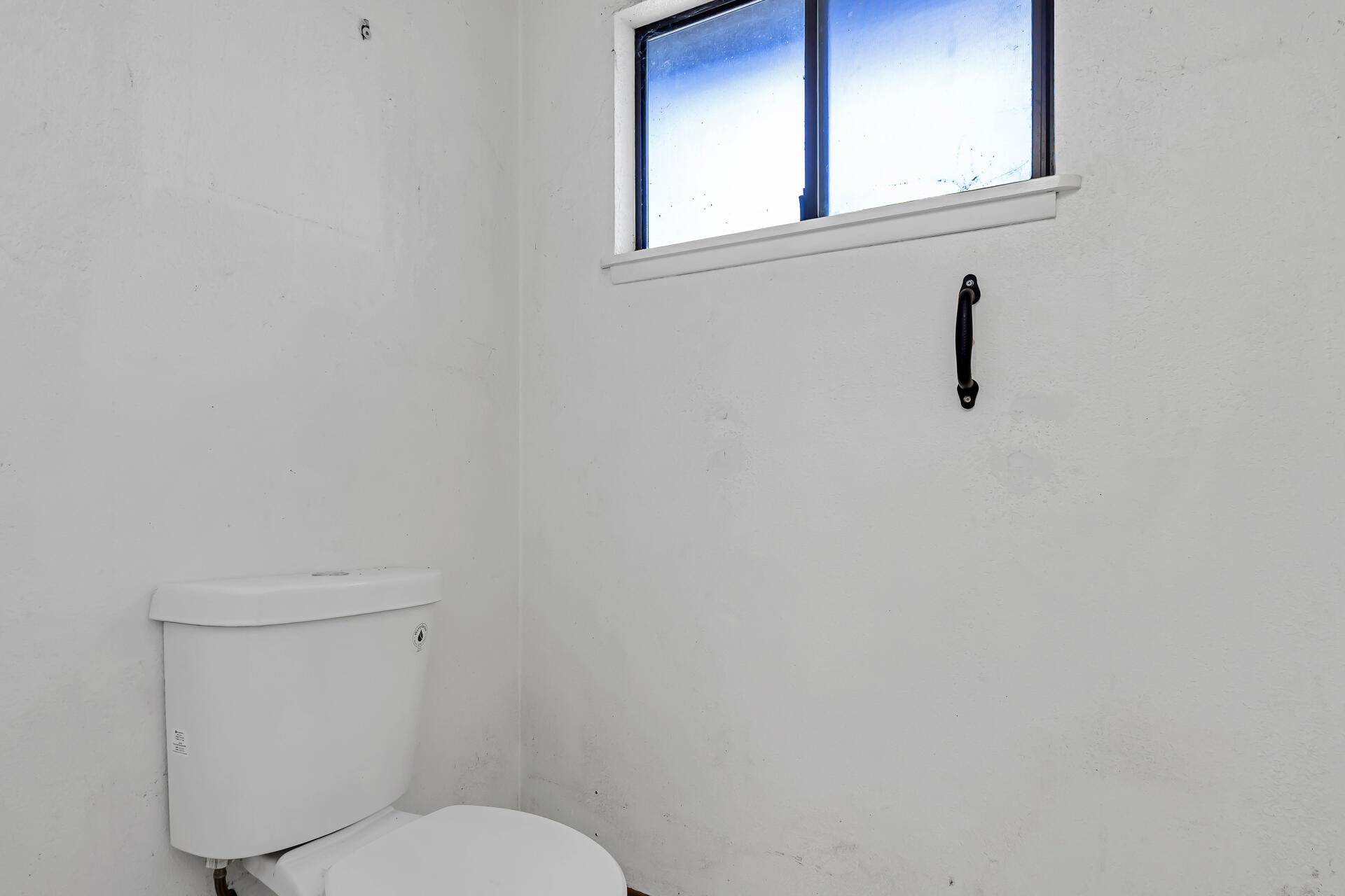 240 D Street Tehama, CA 96090 - Photo 24 of 41 a white toilet sitting next to a window