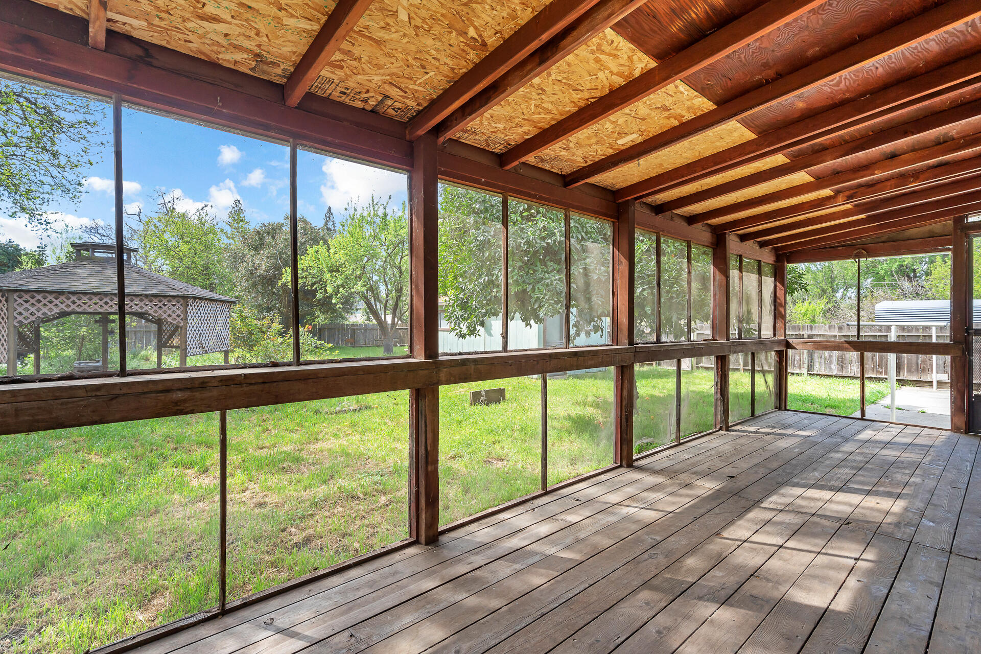 240 D Street Tehama, CA 96090 - Photo 28 of 41 a view of porch with a floor to ceiling window wooden floor and tree