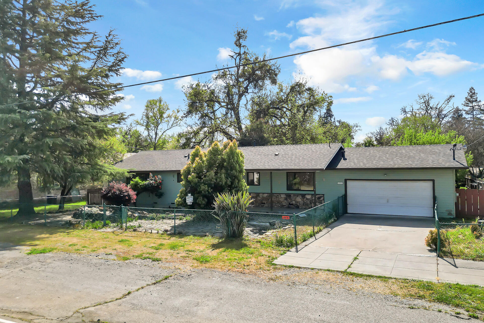 240 D Street Tehama, CA 96090 - Photo 3 of 41 a front view of a house with a yard and garage