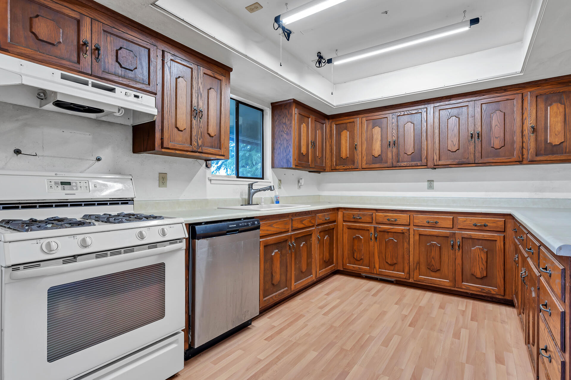 240 D Street Tehama, CA 96090 - Photo 7 of 41 a kitchen with stainless steel appliances granite countertop wooden cabinets stove top oven and sink