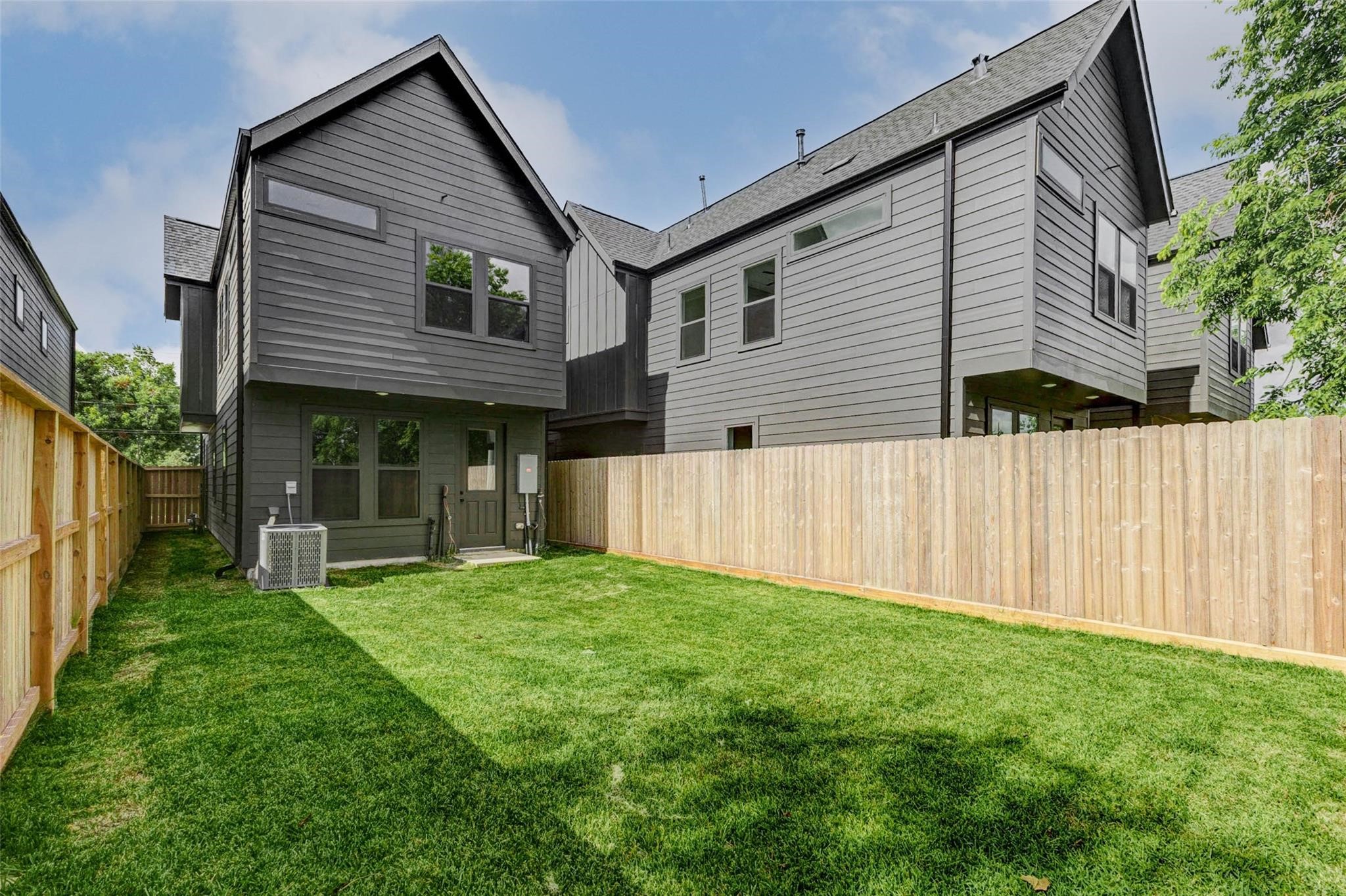 8008 Sunbury Street Houston, TX 77028 - Photo 2 of 42 a front view of a house with a yard and garage