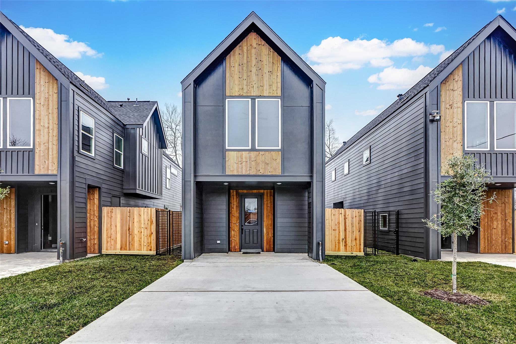 8008 Sunbury Street Houston, TX 77028 - Photo 3 of 45 a front view of a house with a garden and garage