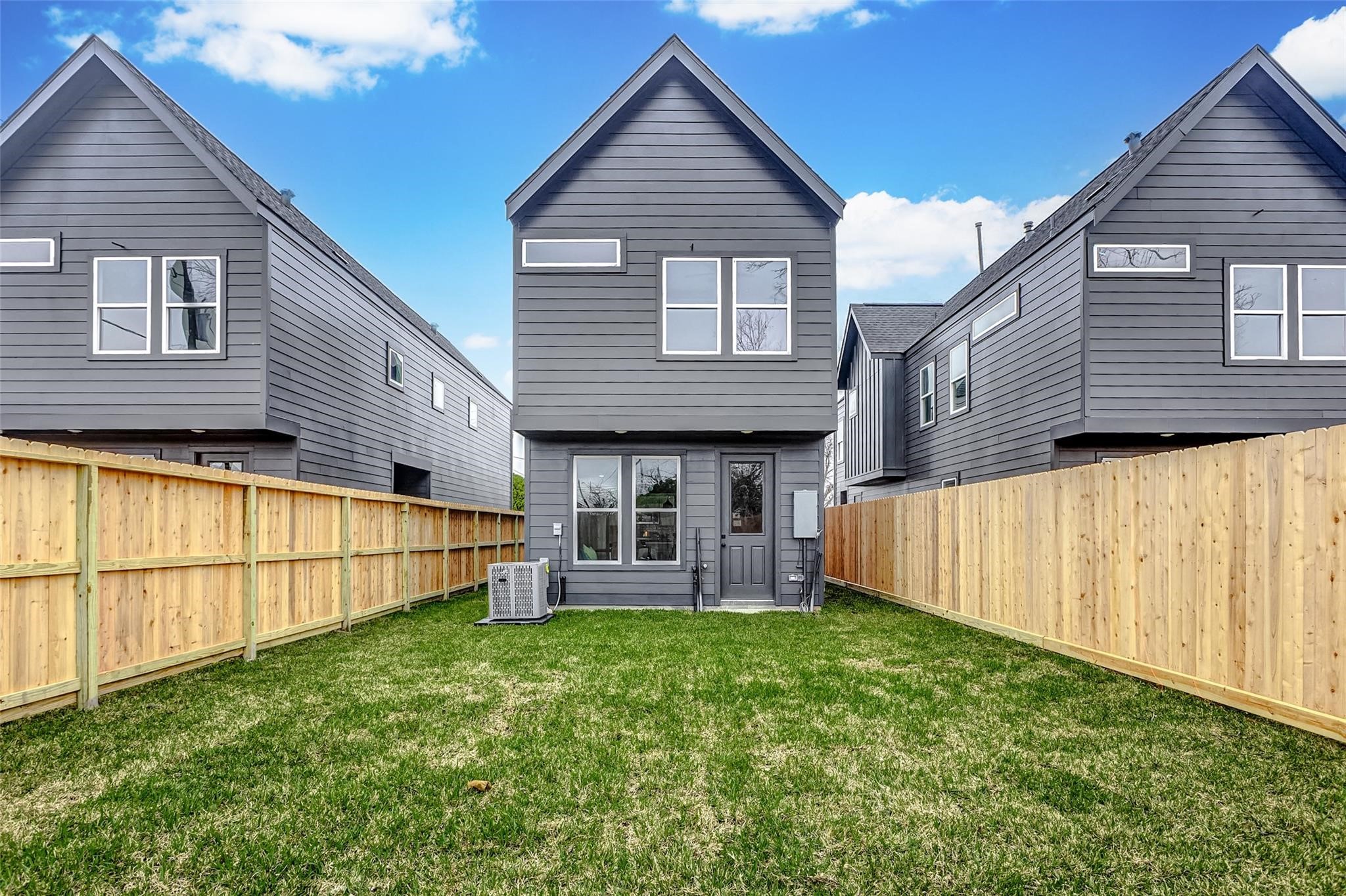8008 Sunbury Street Houston, TX 77028 - Photo 44 of 45 a view of a house with a small yard and wooden fence