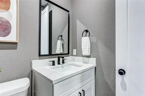 a bathroom with a sink and a toilet