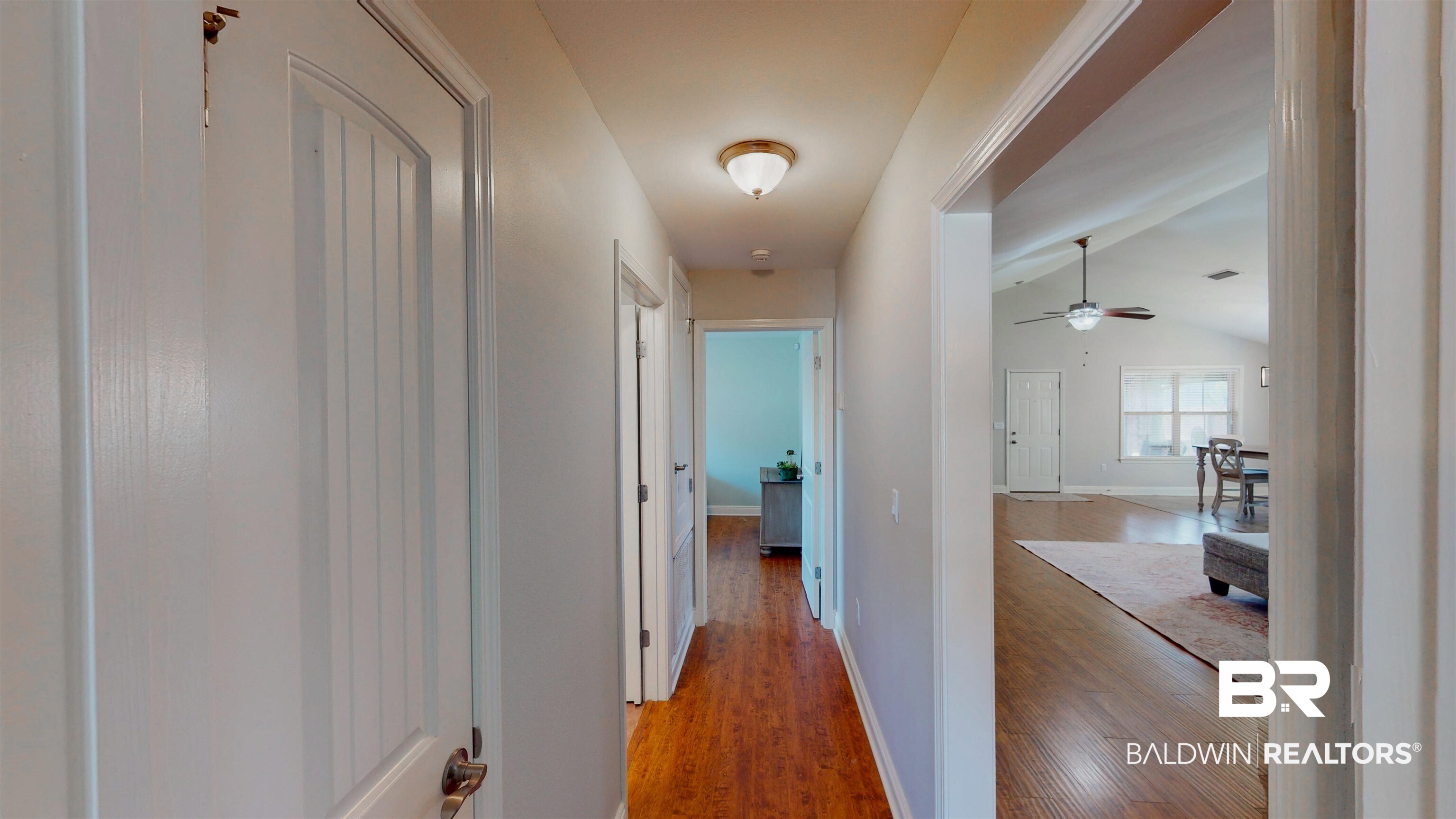 1704 Arcadia Drive Foley, AL 36535 - Photo 9 of 52 Corridor featuring wood finished floors and lofted ceiling