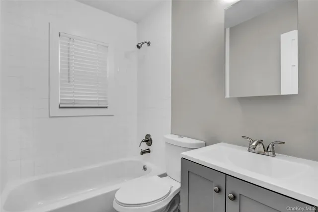 a bathroom with a sink toilet and bathtub