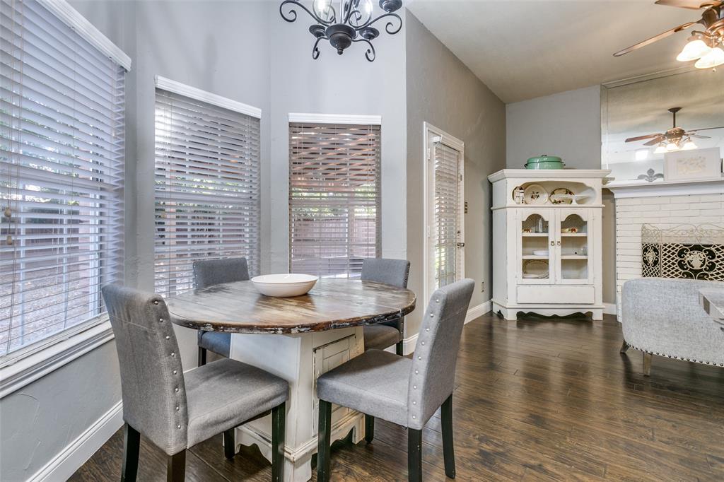 2133 Rim Rock Drive Keller, TX 76248 - Photo 21 of 37 Dining area with a ceiling fan, dark wood-type flooring, and a chandelier