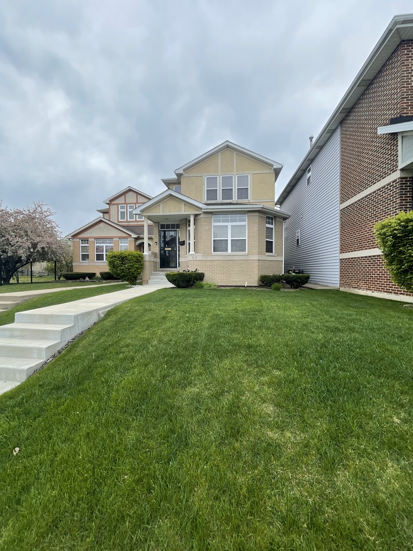 53 East 90th Street Chicago, IL 60619 - Photo 1 of 1 a front view of a house with a garden