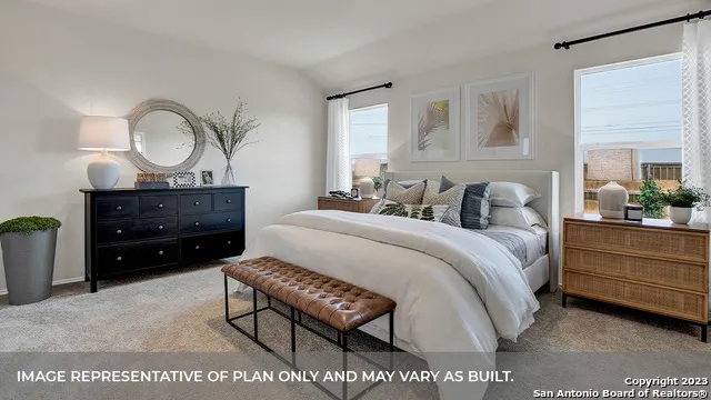 a bed room with a bed and a dresser