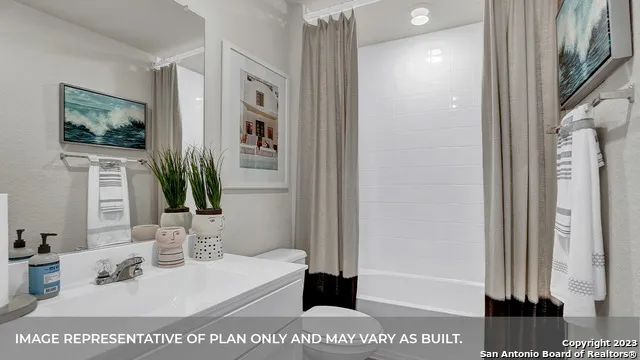 a bathroom with a sink a mirror and shower