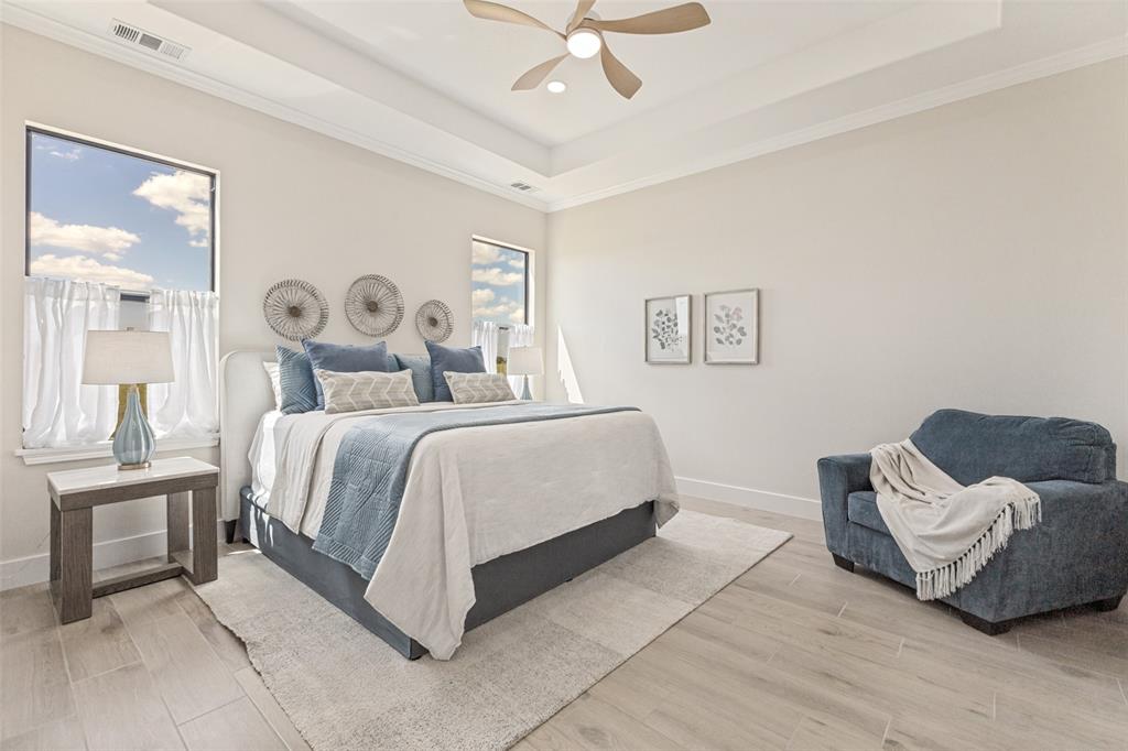 3150 Crisp Road Ennis, TX 75119 - Photo 15 of 30 Primary bedroom featuring tray ceiling with crown molding, ceiling fan, and recessed lighting