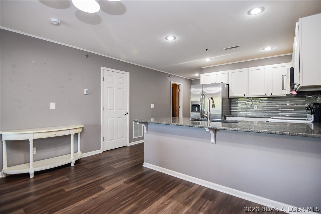 194 Sac Road, Unit D301 Sunrise Beach, MO 65079 - Photo 5 of 43 Dining to kitchen. Laundry room next to kitchen