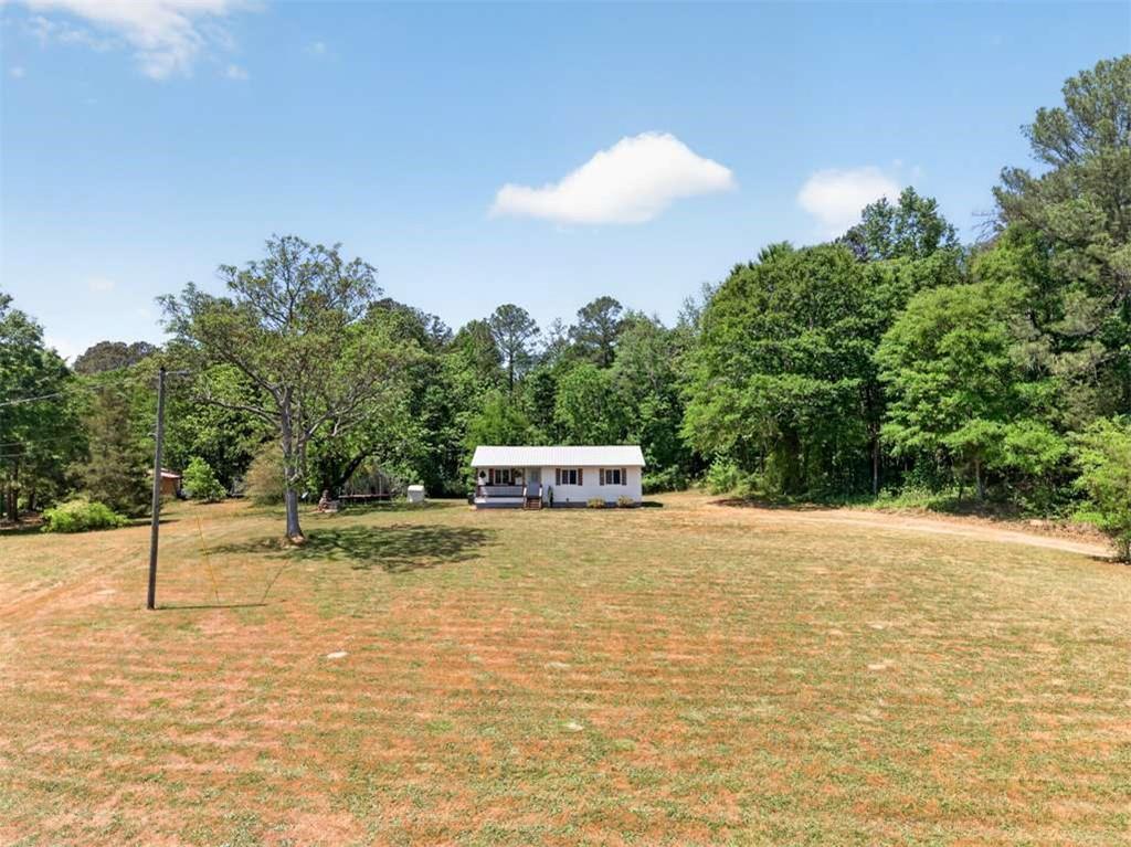 3696 Crabapple Hollow Road Nicholson, GA 30565 - Photo 32 of 38 a swimming pool with an outdoor space and seating area