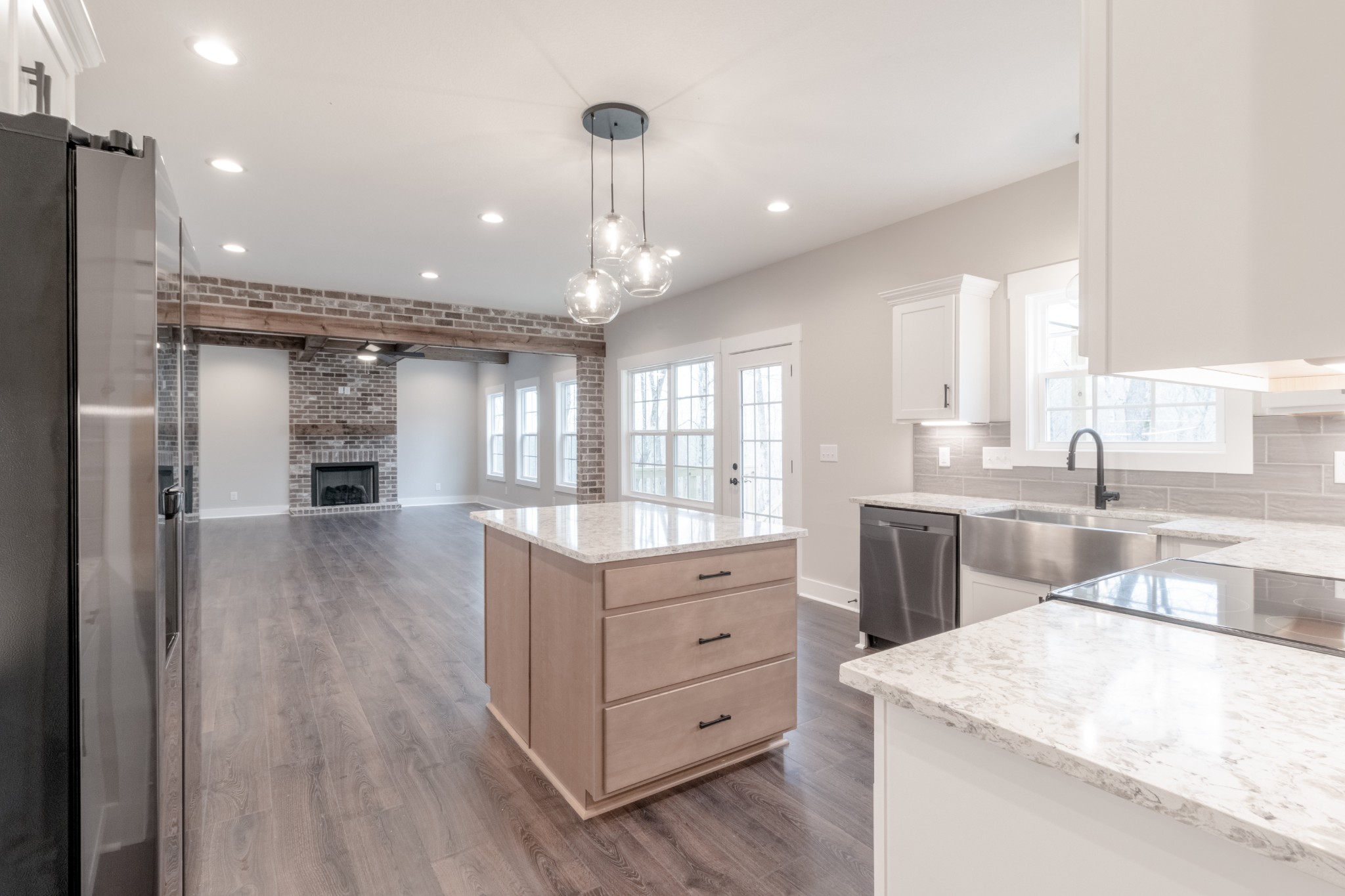 600 Swift Lane Cunningham, TN 37052 - Photo 14 of 38 a kitchen with a sink a counter top space stainless steel appliances and a window
