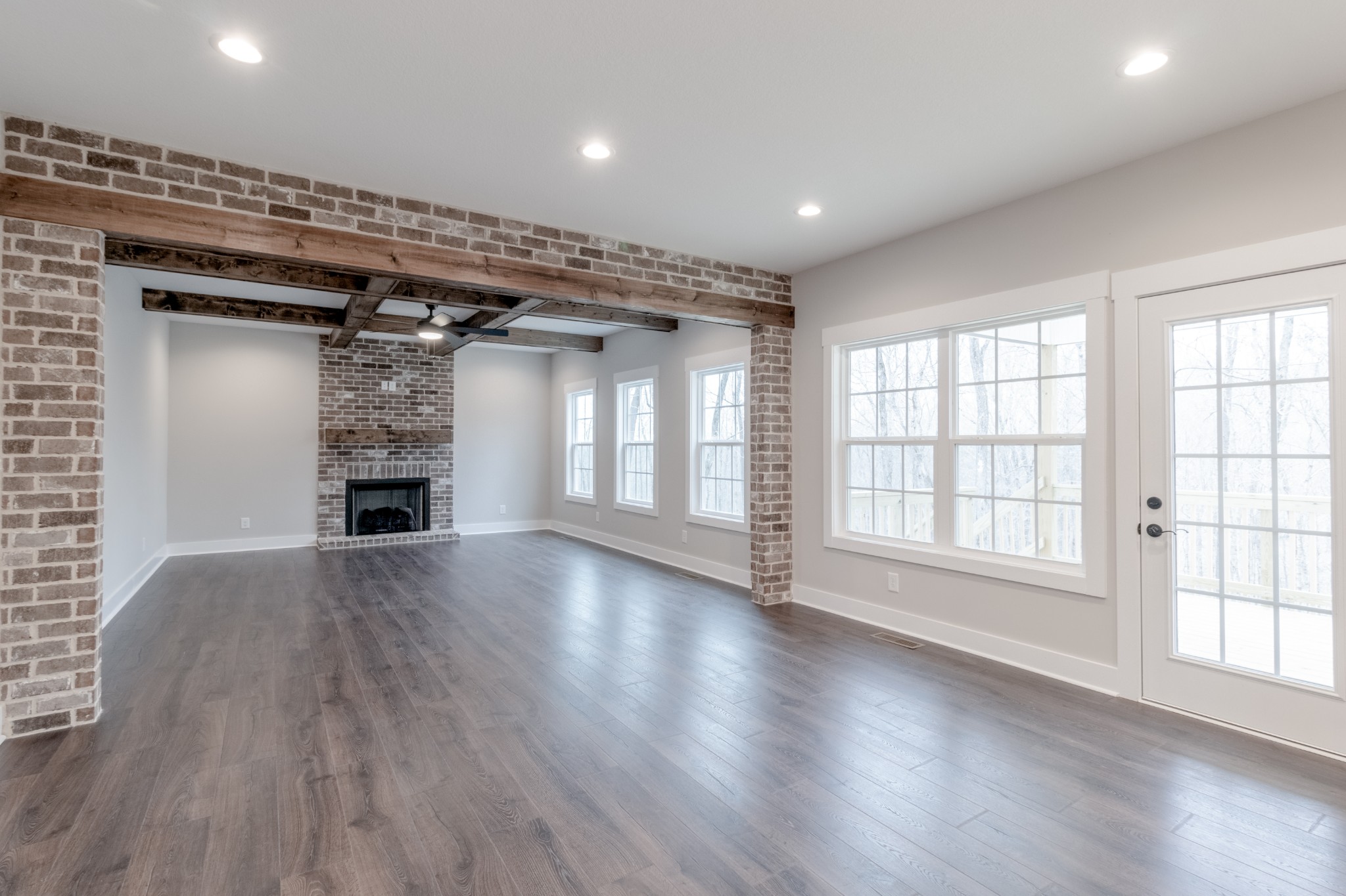 600 Swift Lane Cunningham, TN 37052 - Photo 8 of 38 an empty room with wooden floor and windows