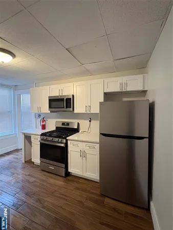 a white refrigerator freezer sitting in a kitchen