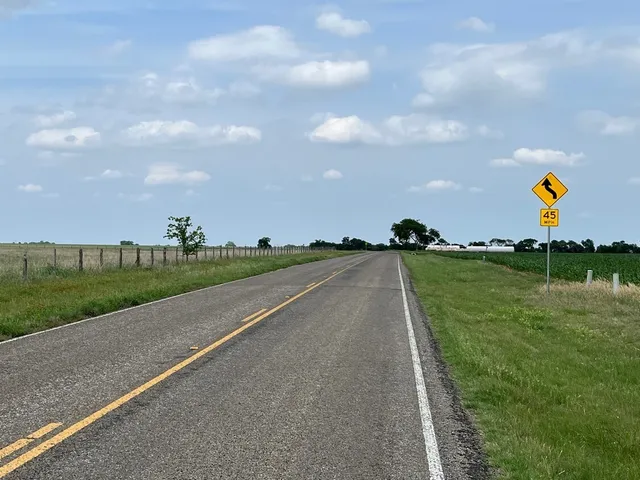 a view of a road with an ocean view