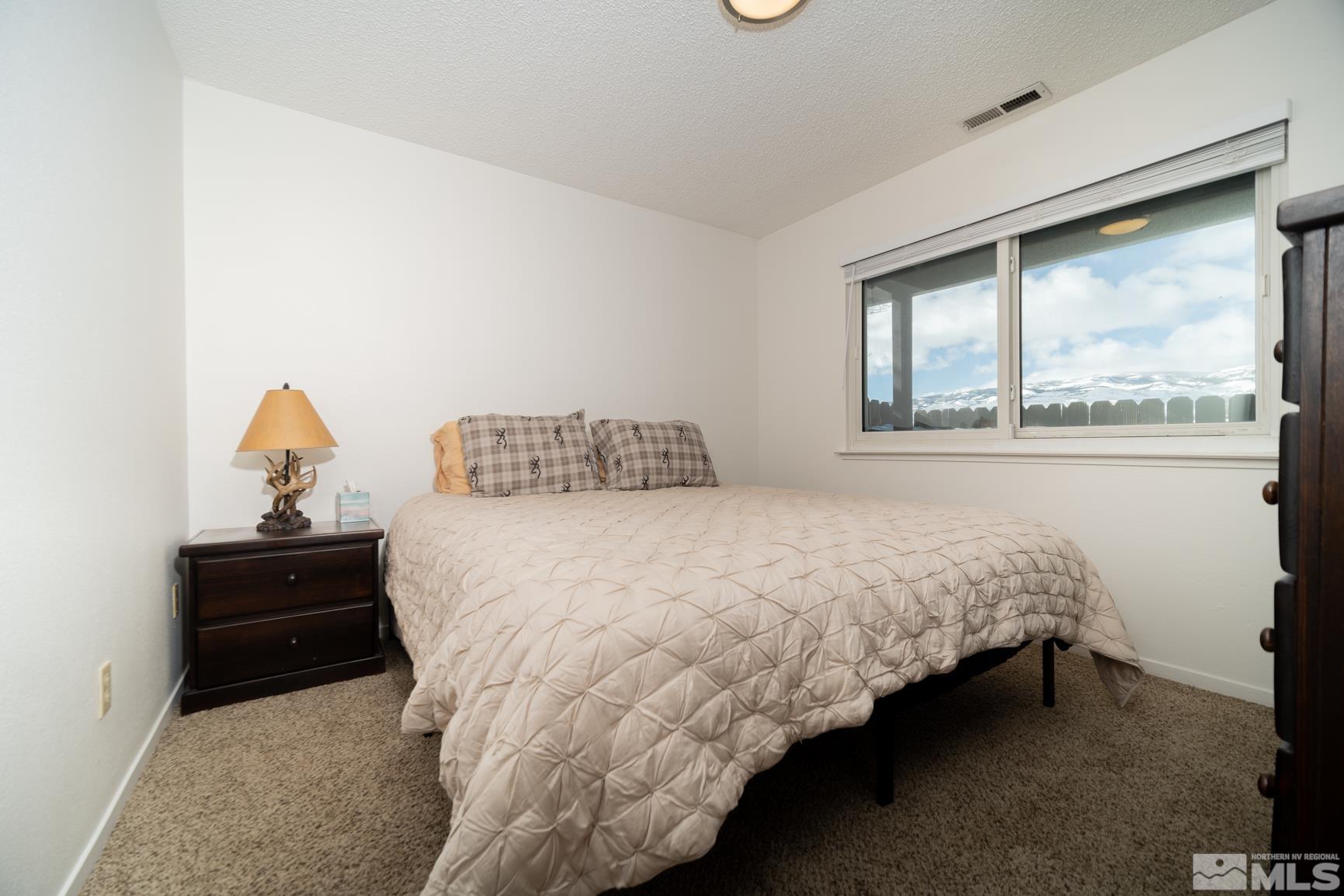 3460 Bowie Road Reno, NV 89503 - Photo 11 of 20 a bedroom with a bed and window
