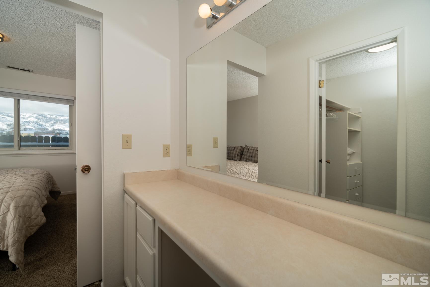3460 Bowie Road Reno, NV 89503 - Photo 14 of 20 a bathroom with a sink and vanity