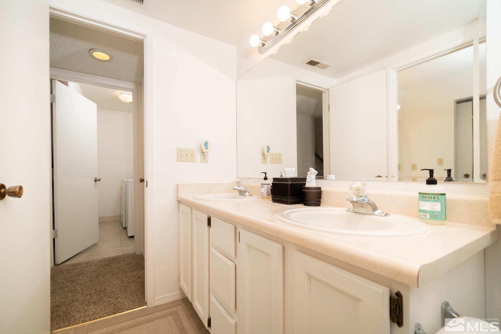 3460 Bowie Road Reno, NV 89503 - Photo 15 of 20 a bathroom with a sink and a mirror