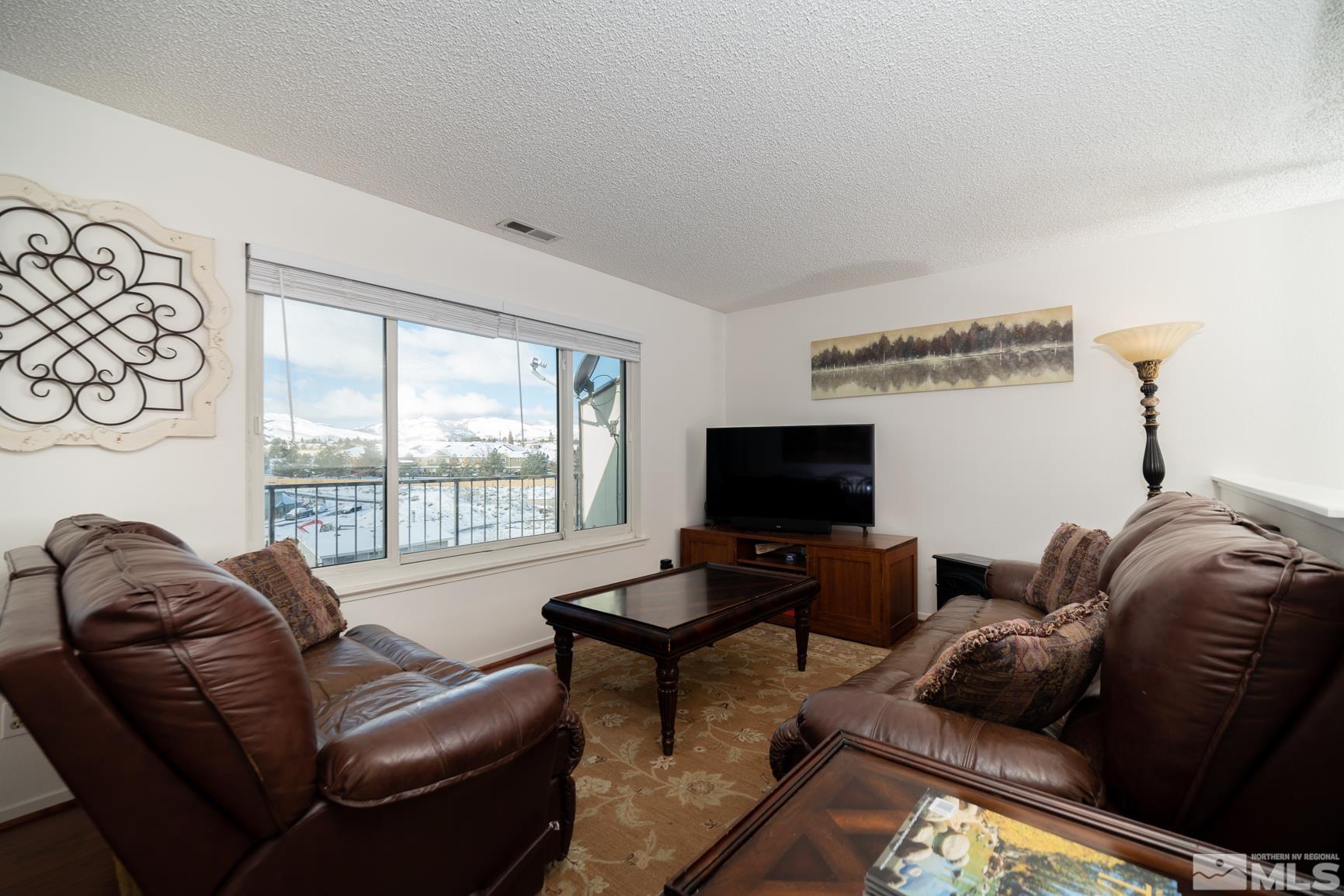 3460 Bowie Road Reno, NV 89503 - Photo 4 of 20 a living room with furniture and a flat screen tv