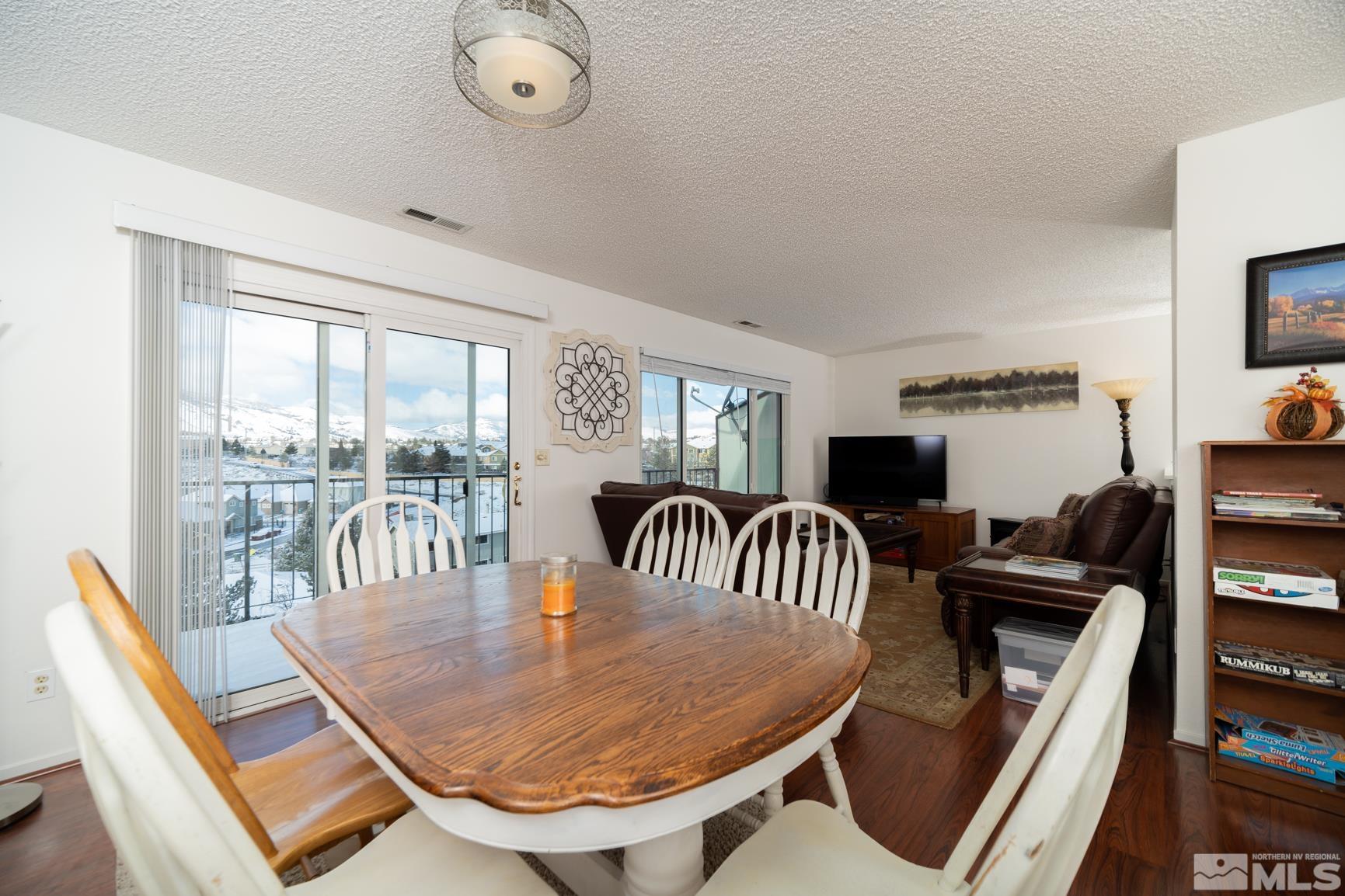 3460 Bowie Road Reno, NV 89503 - Photo 5 of 20 a dining room with furniture and a floor to ceiling window