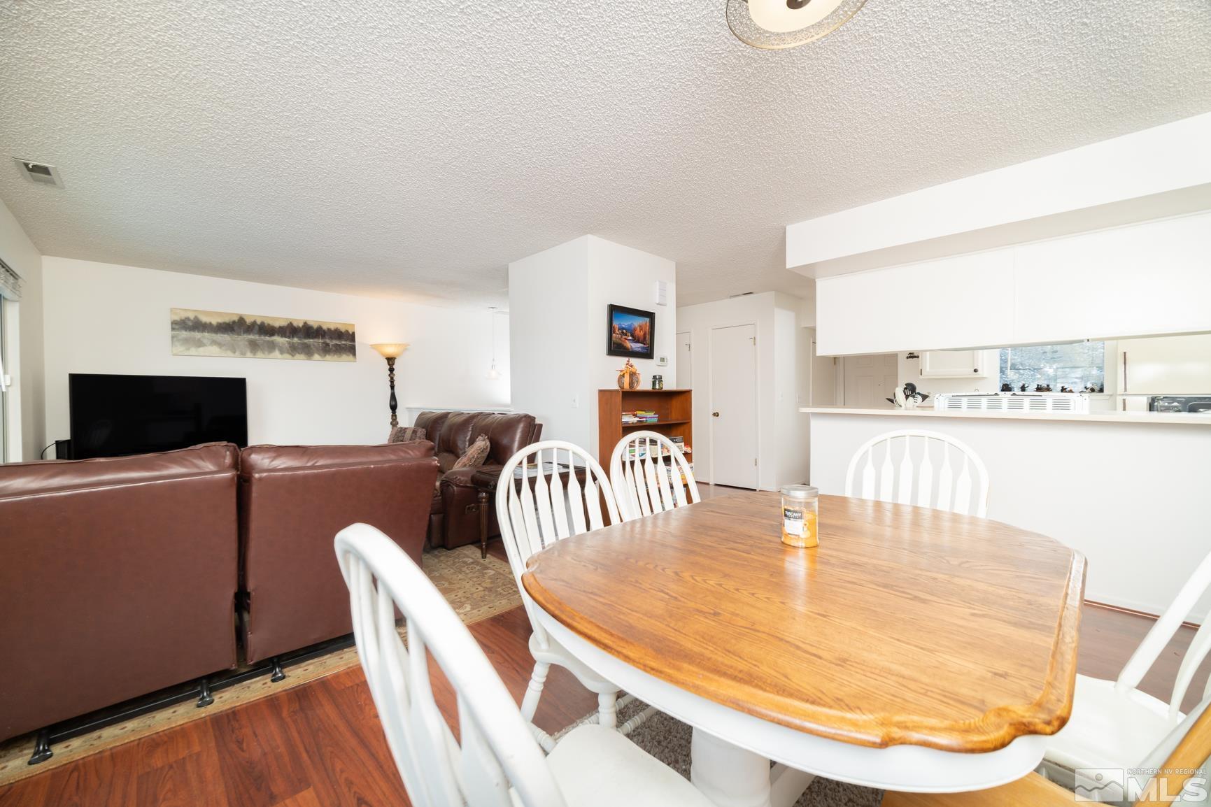3460 Bowie Road Reno, NV 89503 - Photo 7 of 20 a dining room with furniture and a flat screen tv