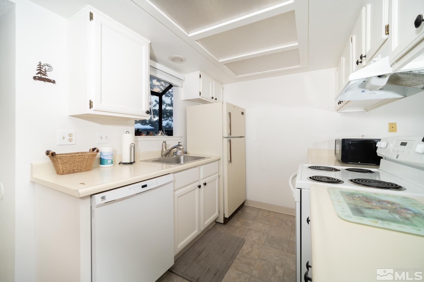 3460 Bowie Road Reno, NV 89503 - Photo 8 of 20 a kitchen with a sink a refrigerator and a stove