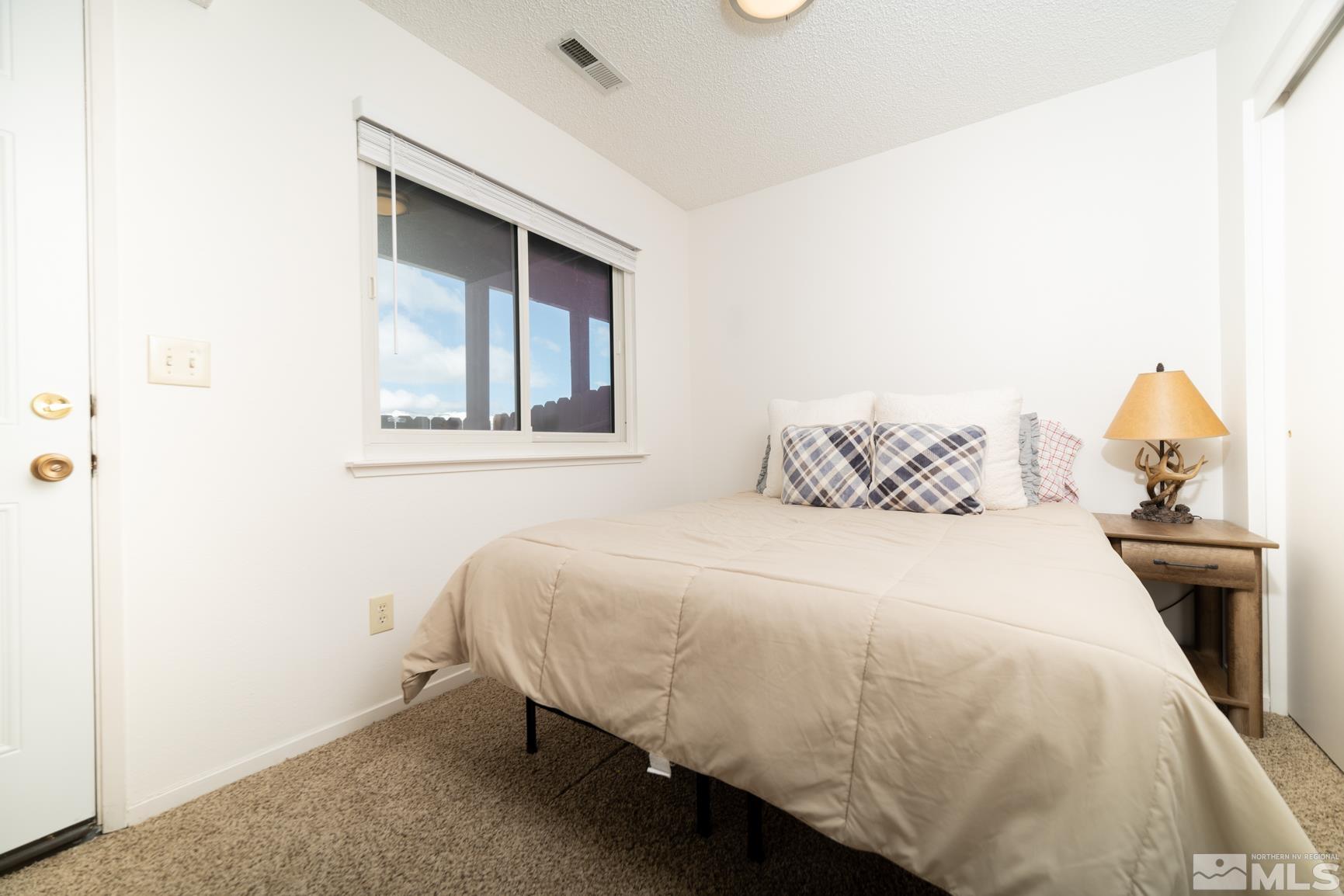 3460 Bowie Road Reno, NV 89503 - Photo 10 of 20 a bedroom with a bed and window