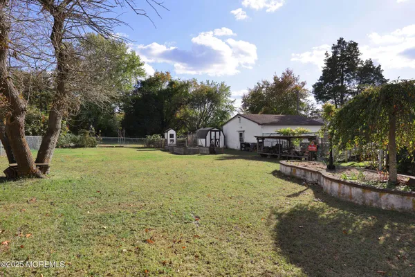 a swimming pool view with a seating space