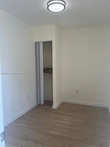 a view of small space with wooden floor