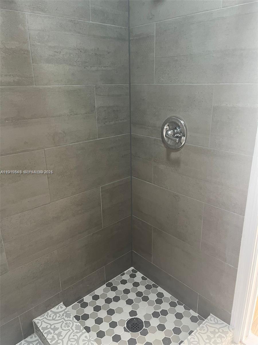 5808 Buchanan Street, Unit 3 Hollywood, FL 33021 - Photo 6 of 7 a bathroom with a shower