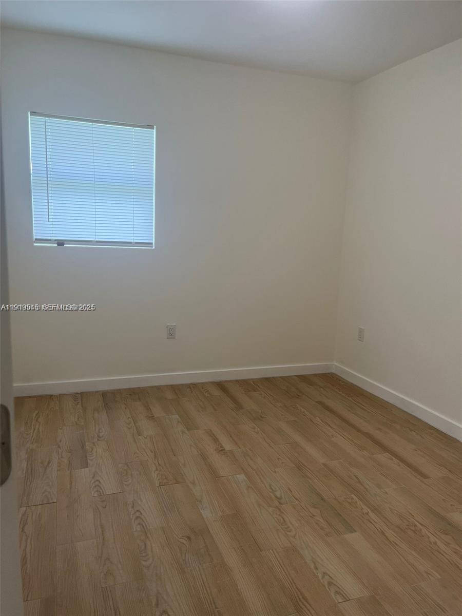 5808 Buchanan Street, Unit 3 Hollywood, FL 33021 - Photo 7 of 7 a view of an empty room