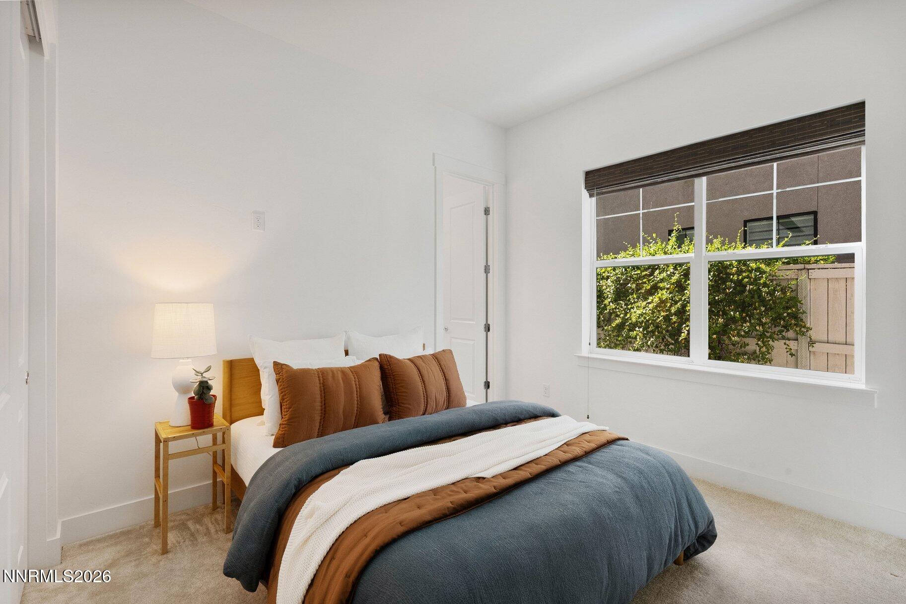 6110 South Pleasant Oak Trail Reno, NV 89511 - Photo 27 of 66 a bedroom with a bed and a window