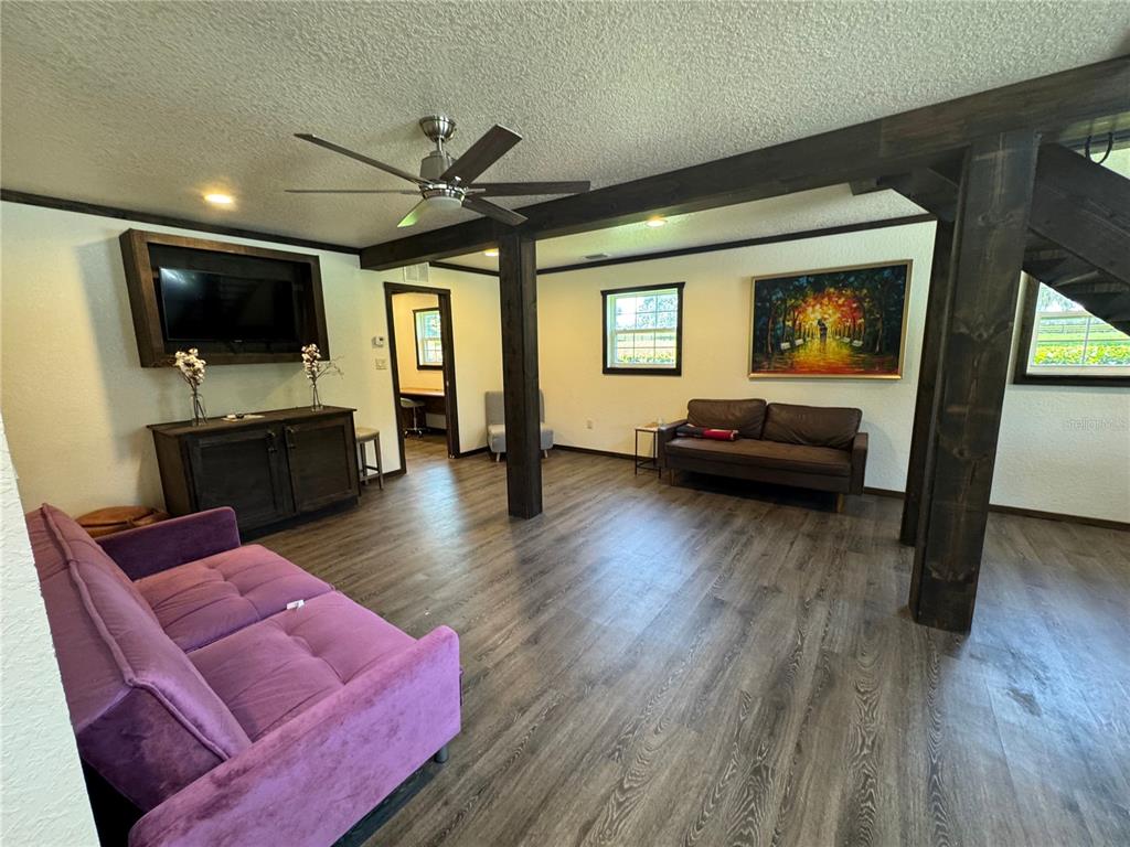 15455 Northwest 100th Avenue Road Reddick, FL 32686 - Photo 3 of 16 a living room with furniture and a flat screen tv
