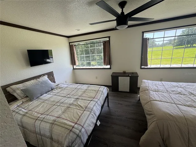 a bedroom with a bed and window